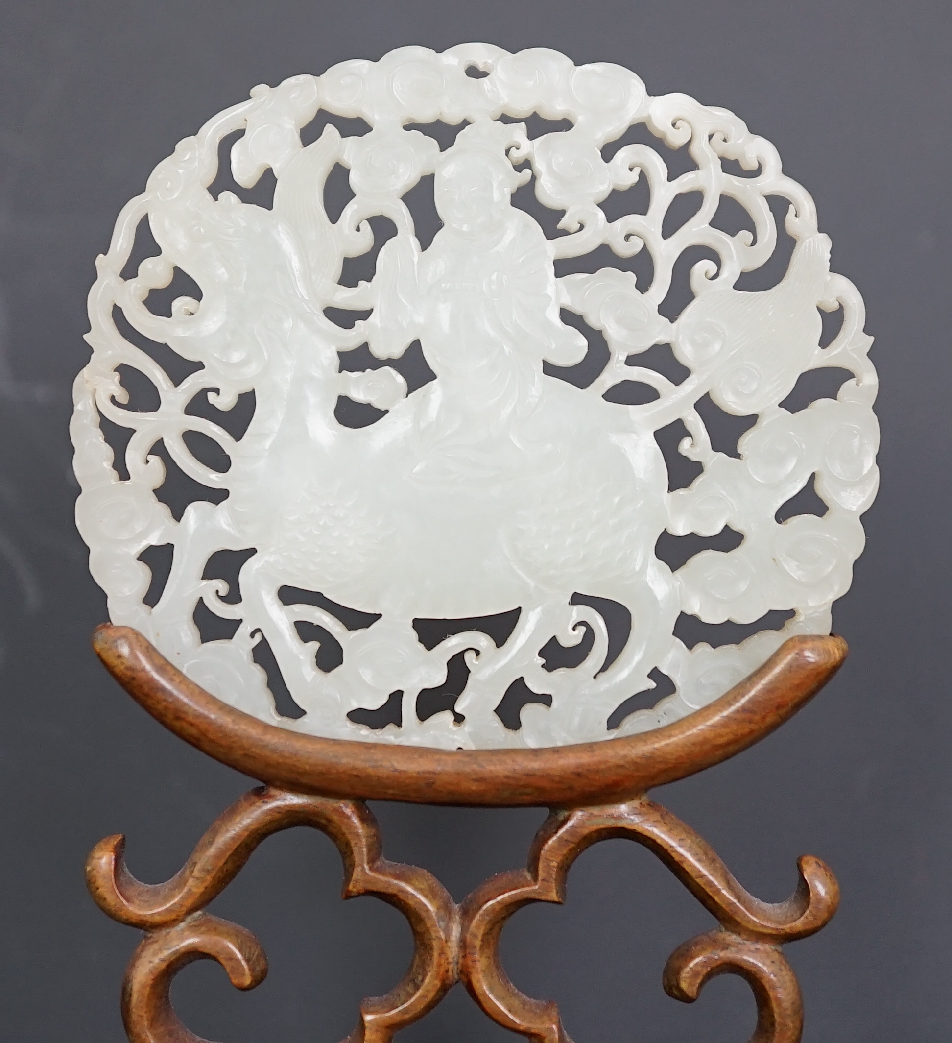 A Chinese white jade ‘qilin and rider’ plaque, 18th/19th century
